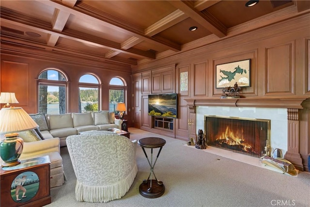 carpeted living room featuring beam ceiling, coffered ceiling, crown molding, wooden walls, and wood ceiling