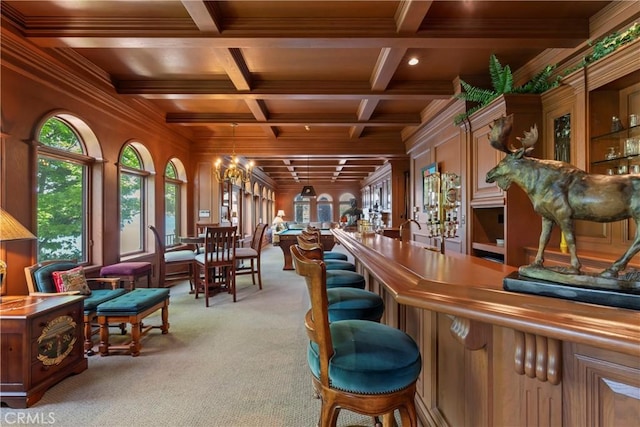 bar with beam ceiling, ornamental molding, light carpet, and coffered ceiling