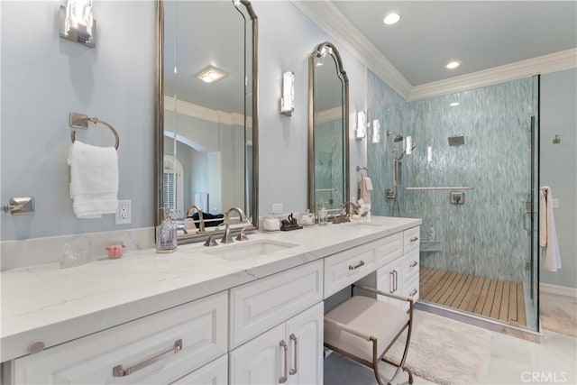 bathroom with a shower with shower door, ornamental molding, and vanity