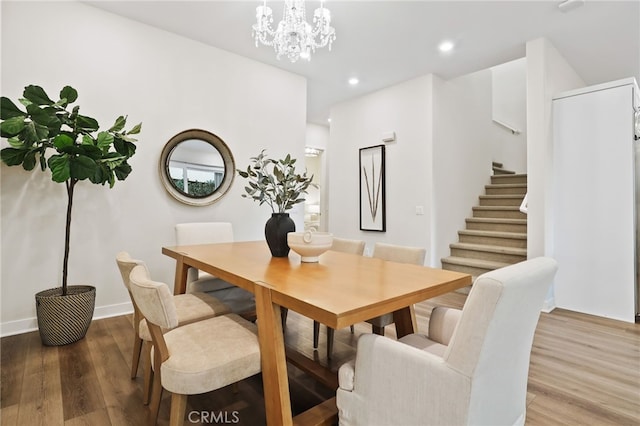 dining area with hardwood / wood-style floors