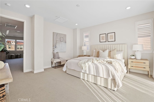 bedroom featuring light colored carpet