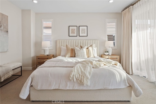 bedroom featuring carpet floors and multiple windows