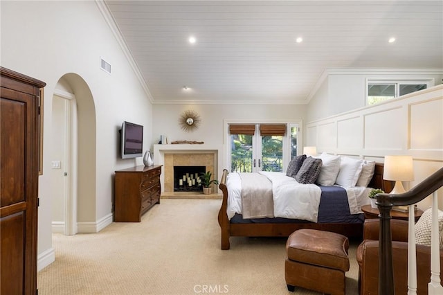 bedroom with light colored carpet, ornamental molding, lofted ceiling, and wood ceiling