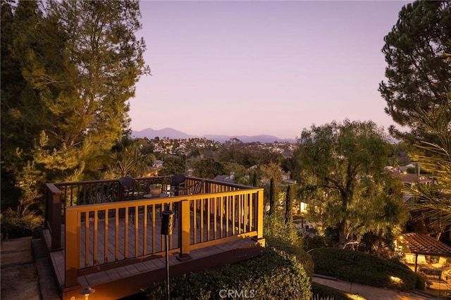 deck at dusk with a mountain view