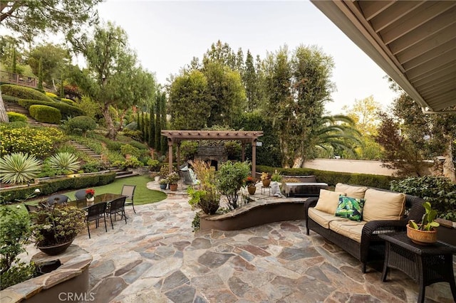 view of patio / terrace with an outdoor living space with a fireplace