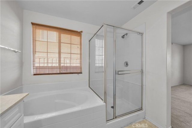 bathroom with vanity and plus walk in shower