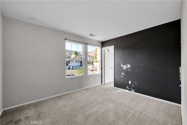 empty room with light colored carpet