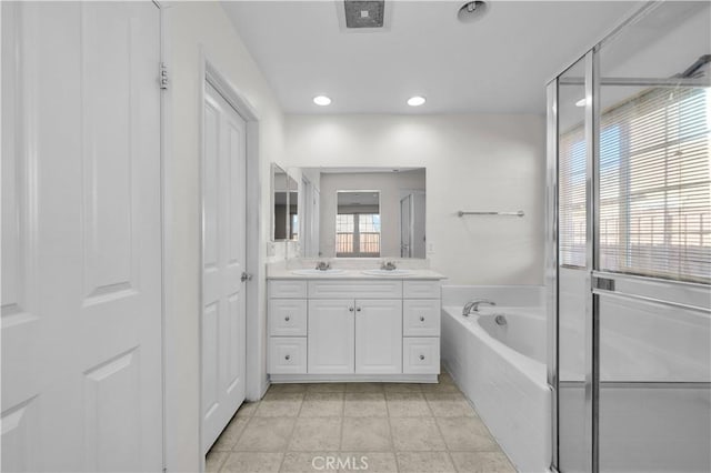 bathroom with shower with separate bathtub and vanity