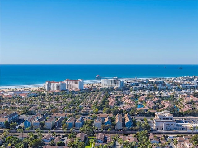 birds eye view of property with a view of the beach and a water view