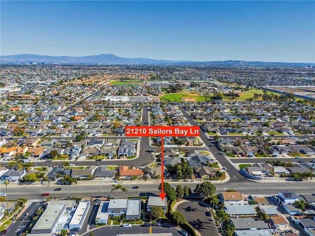 birds eye view of property with a mountain view