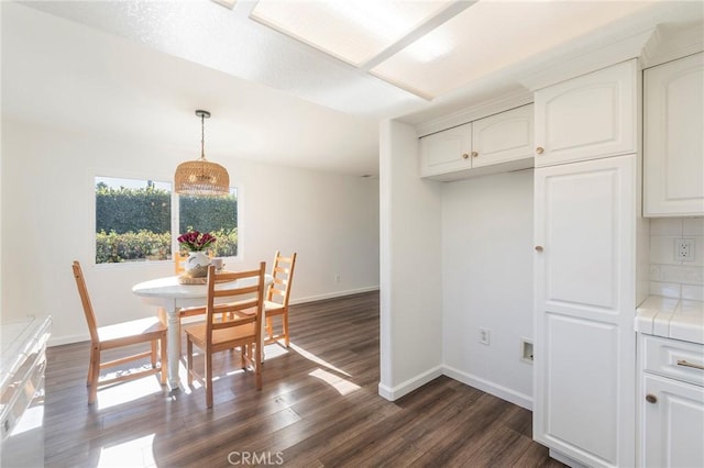 dining area featuring dark hardwood / wood-style floors