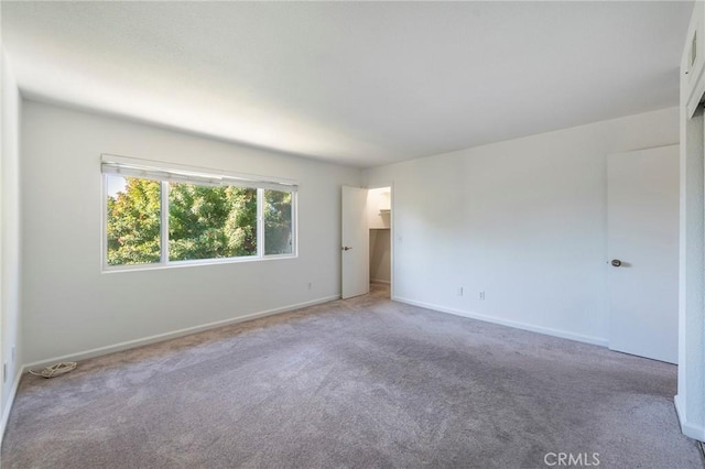 unfurnished room featuring carpet