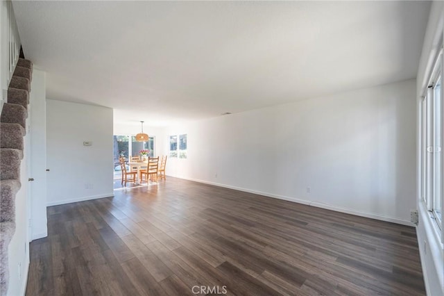 empty room with dark hardwood / wood-style floors