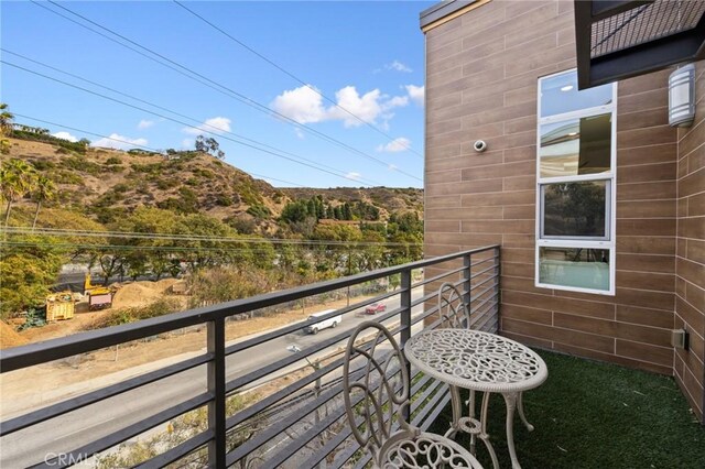 balcony featuring a mountain view