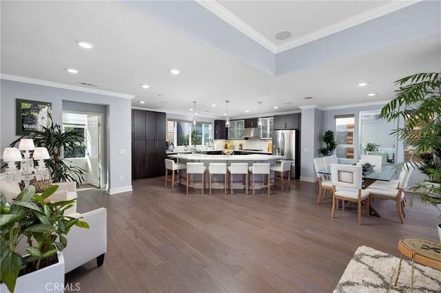 living room with crown molding and dark hardwood / wood-style floors