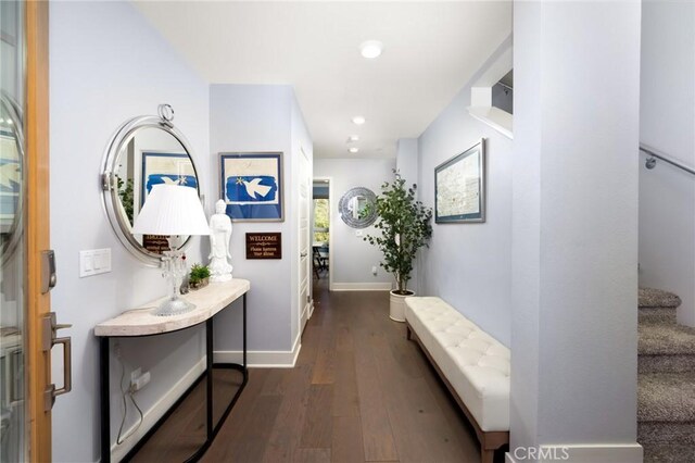 hallway with dark wood-type flooring