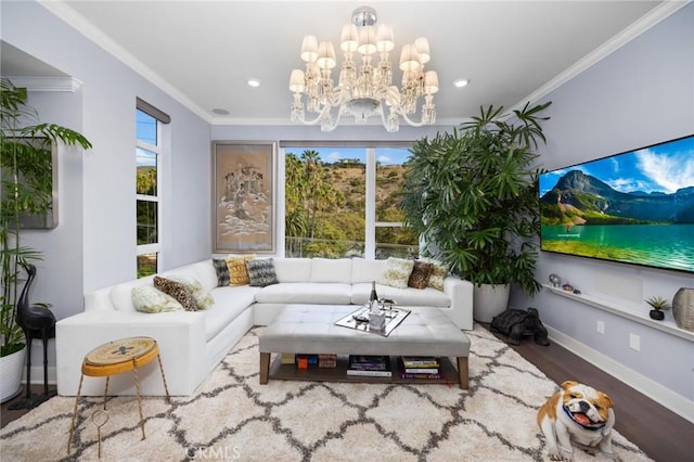 living room featuring hardwood / wood-style flooring, crown molding, and a notable chandelier