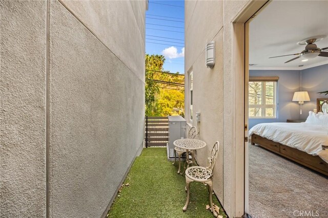 exterior space with ceiling fan