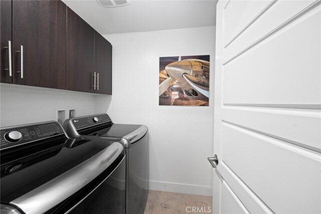 laundry area with cabinets and independent washer and dryer