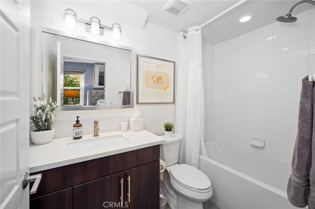 full bathroom featuring vanity, toilet, and shower / bath combo