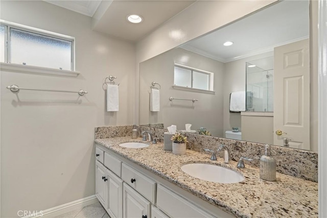 bathroom featuring toilet, a healthy amount of sunlight, and ornamental molding