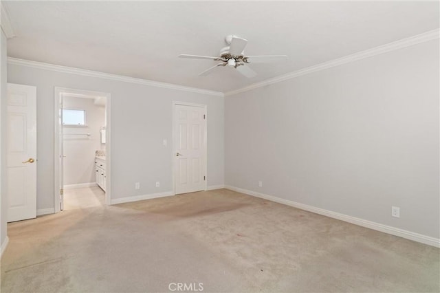 unfurnished room featuring crown molding, light colored carpet, and ceiling fan