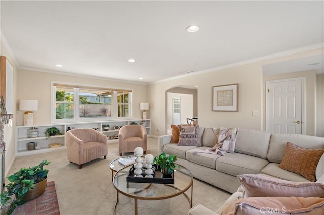 carpeted living room with ornamental molding