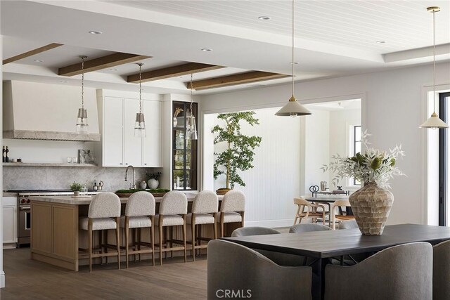 702 Saint James Pl, Newport Beach, CA 92663 - kitchen featuring stainless steel range, dark wood-style flooring, plenty of natural light, tasteful backsplash, and beamed ceiling