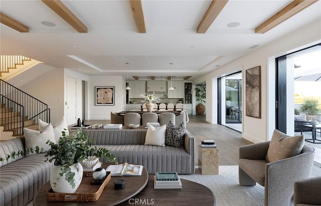 702 Saint James Pl, Newport Beach, CA 92663 - living area featuring light wood finished floors, stairway, beam ceiling, and a tray ceiling