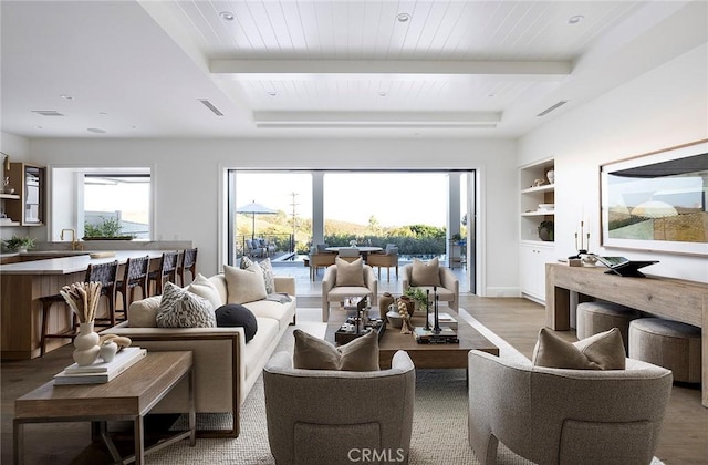 702 Saint James Pl, Newport Beach, CA 92663 - living room featuring plenty of natural light, built in shelves, light wood-style floors, and a wooden ceiling with exposed beams