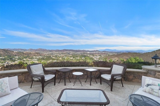 view of patio featuring a mountain view and outdoor lounge area