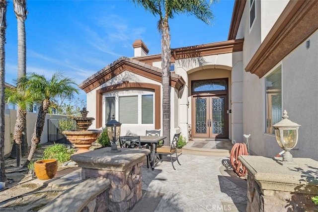 view of patio featuring french doors