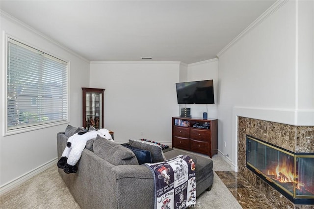 carpeted living room with a premium fireplace and crown molding