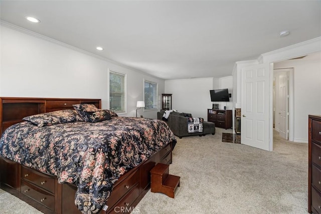 bedroom with ornamental molding and light carpet