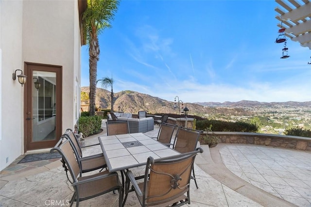 view of patio / terrace featuring a mountain view