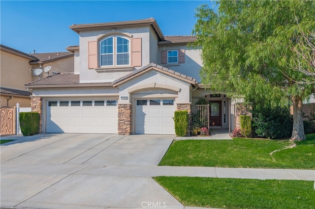 view of front of property with a front lawn and a garage