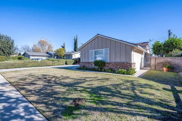 view of property exterior featuring a lawn