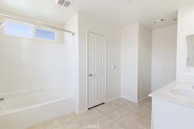 bathroom with vanity and washtub / shower combination