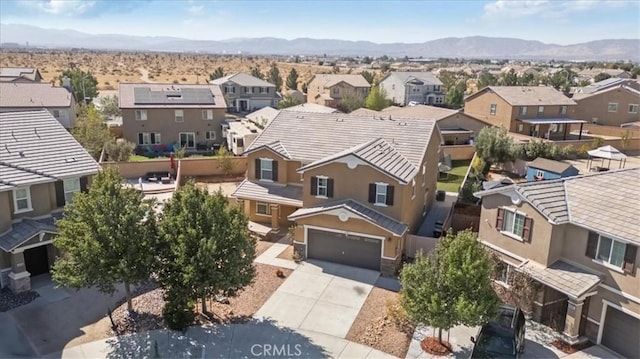 birds eye view of property featuring a mountain view