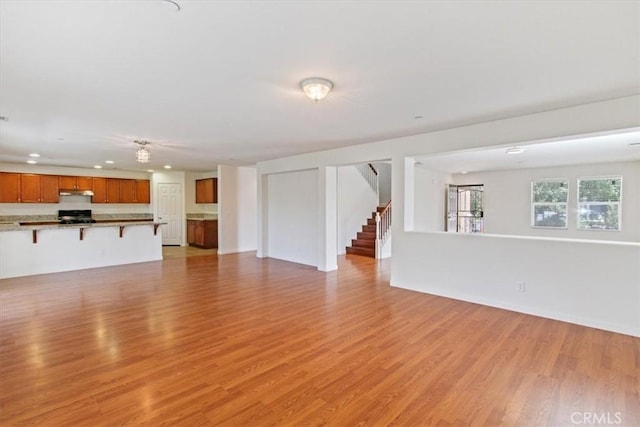 unfurnished living room featuring light hardwood / wood-style flooring