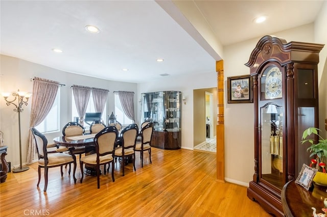 dining space featuring light wood-type flooring