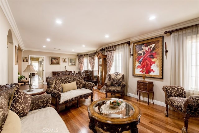 interior space featuring crown molding and hardwood / wood-style flooring