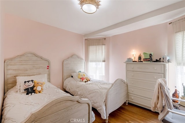 bedroom featuring light hardwood / wood-style floors and multiple windows