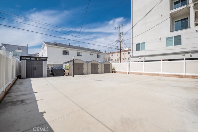 view of patio with a storage unit