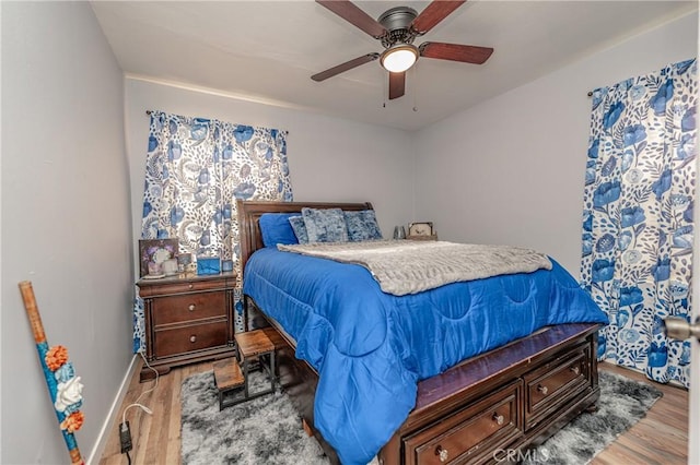 bedroom featuring light hardwood / wood-style floors and ceiling fan