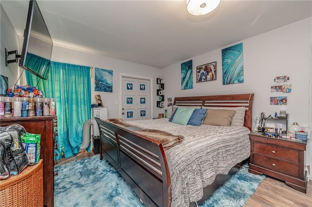 bedroom with light hardwood / wood-style floors