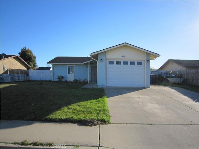 ranch-style house with a garage and a front lawn