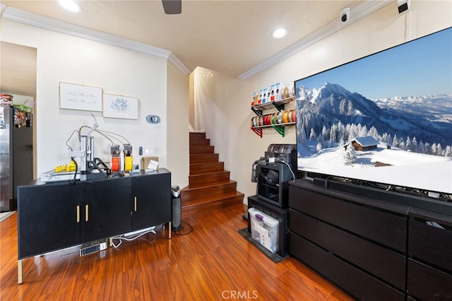 living room featuring wood-type flooring and crown molding