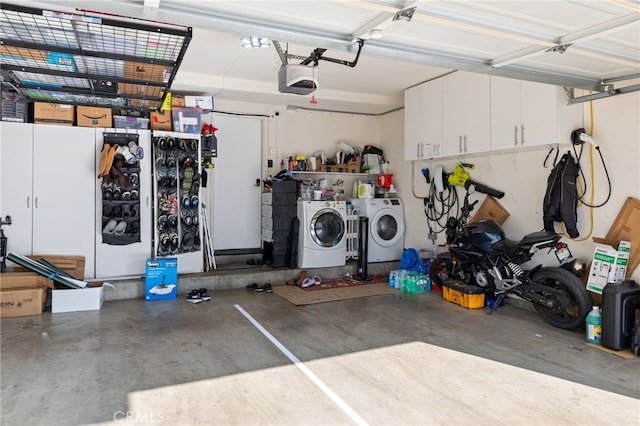 garage featuring a garage door opener and washer and dryer