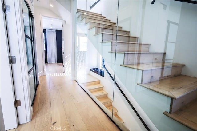 staircase featuring hardwood / wood-style floors